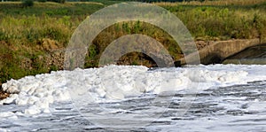 White foam forming on the surface of a river