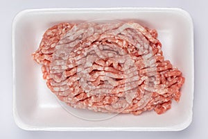 A white foam tray of raw minced pork from supermarket, fresh foo