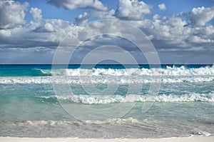 White foamy waves and gradually darkening color of sea water