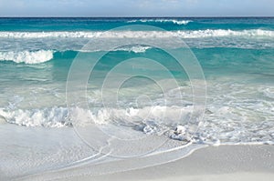 White foamy waves and gradually darkening color of sea water photo