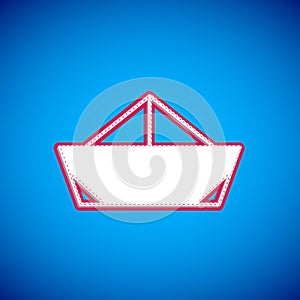 White Folded paper boat icon isolated on blue background. Origami paper ship. Vector