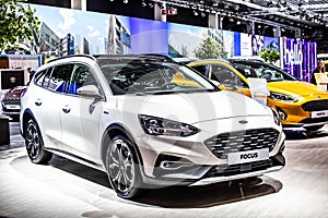 White Ford Focus station wagon, Brussels Motor Show,  4th gen, compact car produced by American automaker Ford Motor