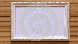 White frame with empty white canvas on natural bamboo wall.