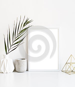 White frame and home decoration details on tabletop with wall, artwork poster mock-up