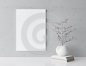 White frame mockup and home decoration on gray wall with white flower vase and books,