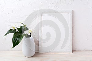 White frame mockup with euxaris flower in vase