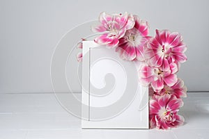 White frame mockup with flowers. Poster product design styled