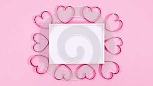 White frame with romantic hearts around moving. Stop motion