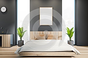 White framed poster on wall, wood bedroom modern interior and home office table with panoramic window, comfortable bed. Concept of
