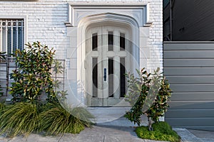 White front door of a classic house in the suburbs