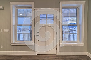 White front door flanked by windows interior