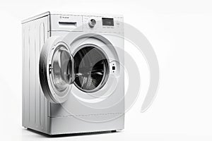 White Front Load Washing Machine Isolated on White Background. Modern Washer with Electronic Control Panel. Side View of Household