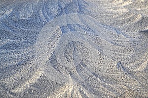 White frost Pattern on the window in winter