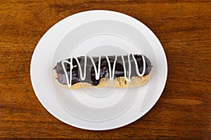 White Frosting on Chocolate Eclaire