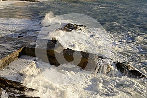 White froth on rough sea, Camogli, Italy