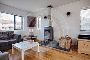 White furnished living room with fire