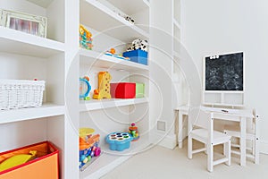 White furnitures in child room photo