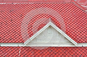 The white gable and red roof