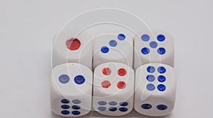 White game cubics with blue and red spikes dots on a white background.