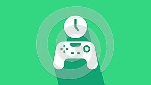 White Gamepad of time icon isolated on green background. Time to play games. Game controller. 4K Video motion graphic