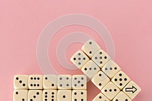 White gaming dices on pink background. victory chance, lucky. pointer. Flat lay, place for text. Top view. Close-up. Concept
