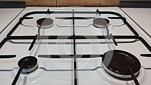 white gas stove with four burners photo