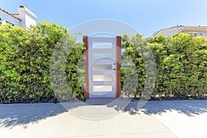 White gate door with glass panels at La Jolla, California