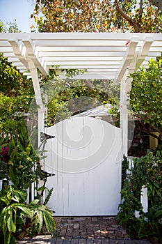 White gate and pergola