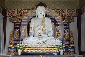 White Gautama Buddha Statue Sitting on Lotus