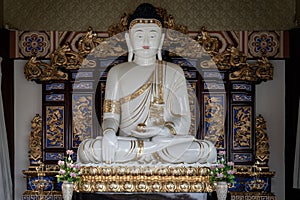 White Gautama Buddha Statue Sitting on Lotus