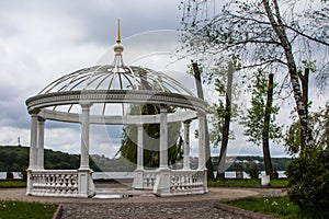 White gazebo on an island in the middle of a lake in Ternopil. Ukraine