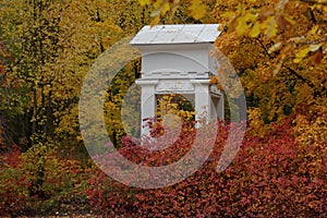 White gazebo in a park.