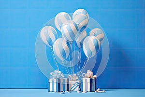 White gift box with blue ribbon and white balloon with blue stripes on blue background. minimal birthday and celebration concept