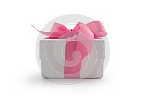 White gift box with pink ribbon bow isolated on white background