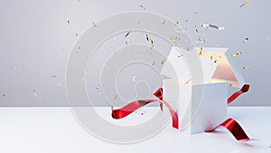 White gift box with red ribbon opens with a deflagration of confetti and a blank letter appears