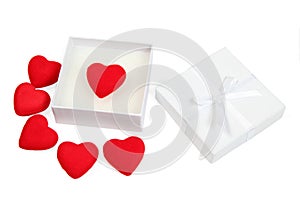 White gift box with red hearts