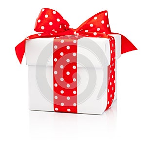 White gift box with red polka dot ribbon bow Isolated on white b