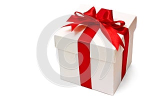 White gift box with a red ribbon and bow