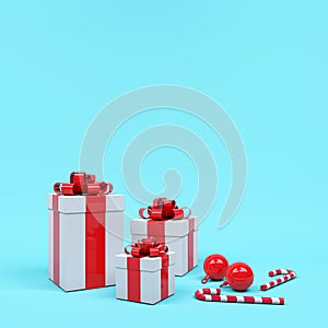 White gift box red ribbon stack among candy in blue background. Minimal Christmas concept idea