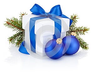White gift box tied blue ribbon and Christmas baubles Isolated on white background