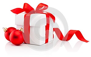 White gift box tied red ribbon bow and two Christmas bauble Isolated on white background