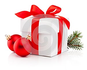 White gift box tied red ribbon bow and two Christmas bauble Isolated on white background