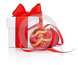 White gift box tied with Red ribbon and two Christmas ball Isolated