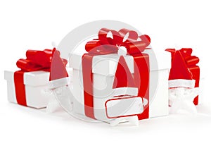 White gift boxes with red ribbons