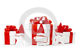 White gift boxes with red ribbons