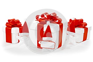 White gift boxes with red ribbons