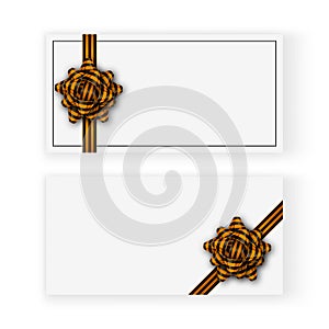 White gift cards with a black and orange tied bow, realistic shadows and copy space. 9 May - Victory day template design