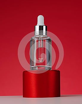 White glass bottle with pipette for cosmetics, oils and serum. Advertising and product promotion