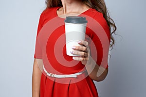 White glass. Hot coffee. Red dress