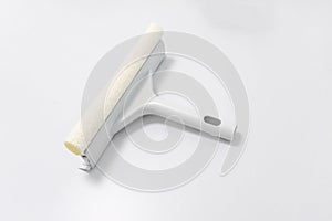 White glass window cleaner with plastic handheld isolated on white background. Window wiper with sponge and blade